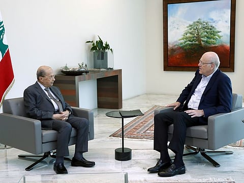 Lebanon’s President Michel Aoun meets with Prime Minister-designate Najib Mikati at the presidential palace in Baabda on July 28, 2021. 
