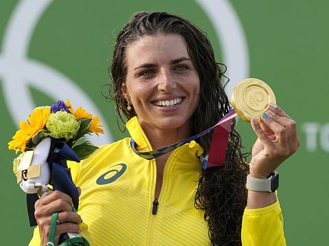 Jessica Fox of Australia holds the gold medal after winning the Women's C1 in the Canoe Slalom at the 2020 Summer Olympics.