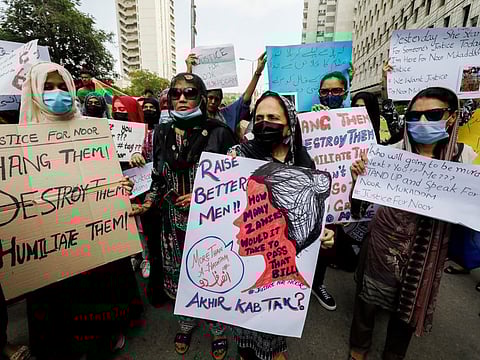 People protesting against the killing of Noor Mukadam, 27 and condemning violence against women and girls in Karachi on July 25, 2021. 