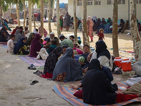 Afghan internally displaced families upon their arrival from the outskirts Kandahar, who fled due to the ongoing battle between Taliban and Afghan security forces, at a refugee camp in Kandahar on July 27, 2021.  