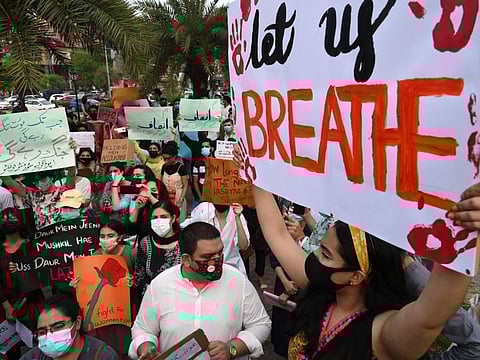 Women rights activists hold placards during a demonstration in Lahore on July 24, 2021, against the brutal killing of Noor Mukadam, the daughter of former Pakistan envoy to South Korea, in the federal capital earlier this week.  