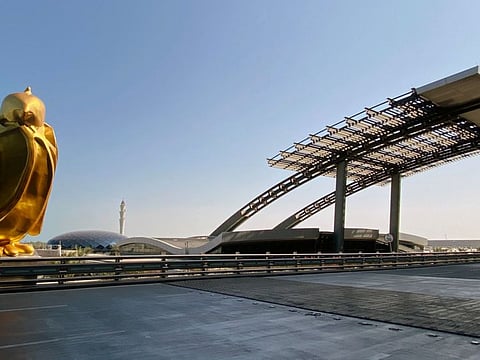 Falcon, a giant gold finished sculpture by Dutch artist Tom Claassen of the hunting bird popular in the Gulf region, is pictured at Doha's Hamad International Airport on July 19, 2021.  