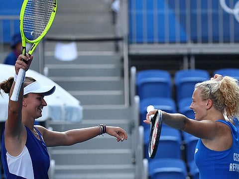 Katerina Siniakova and Barbora Krejcikova of Czech Republic celebrate after winning their gold medal match against Viktorija Golubic and Belinda Bencic of Switzerland 