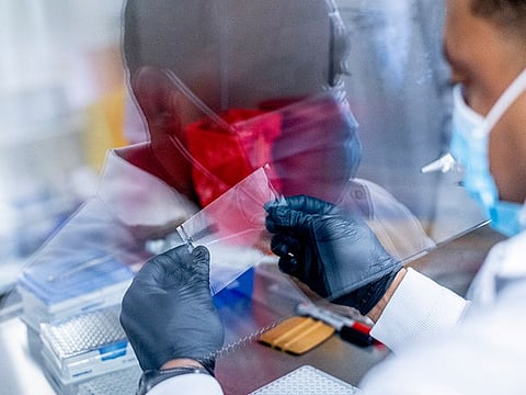 A medical technician works with coronavirus samples at Louisiana State University Health Shreveport, which is tracking where Delta and other variants are spreading, in Shreveport, Louisiana. A recent study showed that Shreveport was in the middle of one of five main clusters of unvaccinated people in the United States vulnerable to large surges and new variants. 