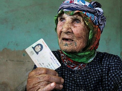 Photos: Oldest Syrian woman shows her ID from 1901 
