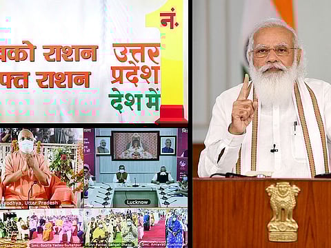  Prime Minister Narendra Modi interacts with the beneficiaries of Pradhan Mantri Garib Kalyan Anna Yojana in Uttar Pradesh, via video conferencing, in New Delhi on Thursday. 