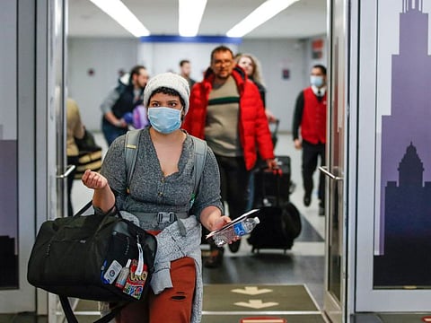 Travellers arrive at the international terminal of the O'Hare Airport in Chicago, Illinois in a file photo. The US, which closed its borders to most foreign travellers as the coronavirus pandemic took hold, plans to allow fully vaccinated visitors to enter the country, a White House official said on August 5, 2021. 