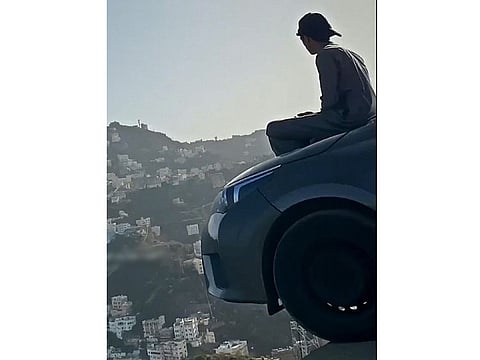 One of the images posted on social media showing the young Saudis on the edge of the abyss in Al Faifa mountains.