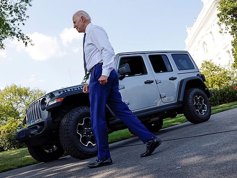 US President Biden returns to the Oval Office after driving a Jeep Rubicon 4xe hosts an event for clean cars and trucks at the White House in Washington.