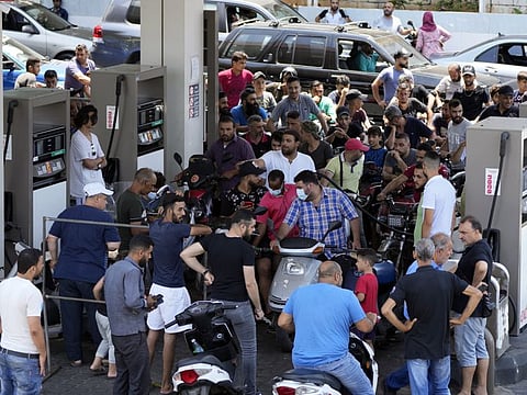 Motorbike drivers wait to get fuel at a gas station in the southern suburb of Beirut, Lebanon. A brawl at a gas station in northern Lebanon over scarce fuel supplies descended into deadly violence on Monday, turning into a fight with knives and guns that killed one man, the country's news agency said. 