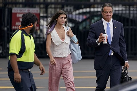 New York Governor Andrew Cuomo prepares to board a helicopter with his daughter Michaela Cuomo after announcing his resignation, on August 10, 2021, in New York.  