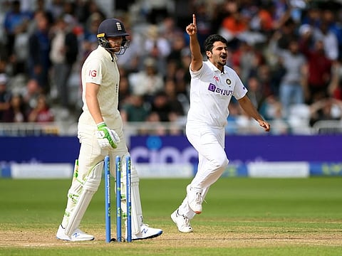 India pacer Shardul Thakur celebrates the wicket of England batsman Jos Buttler during the 4th day of the first Test match between England and India, at Trent Bridge in Nottingham on Saturday. 