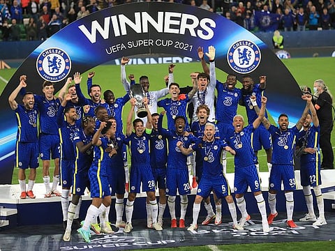 Chelsea players celebrate with the trophy after winning the UEFA Super Cup soccer match against Villarreal at Windsor Park in Belfast, Northern Ireland, Wednesday, Aug. 11, 2021.