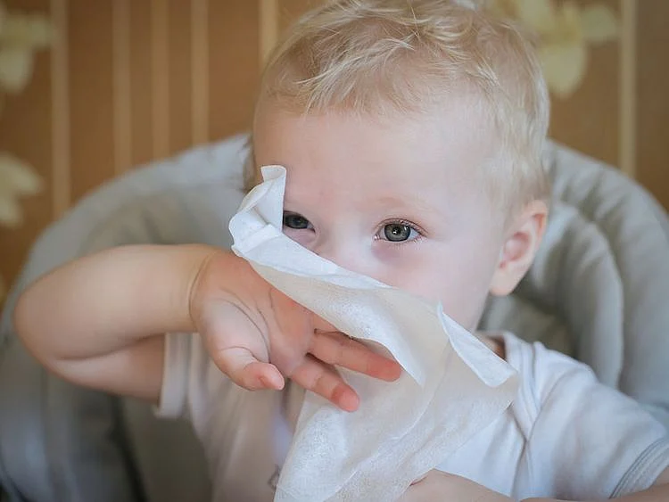 Child eating tissue