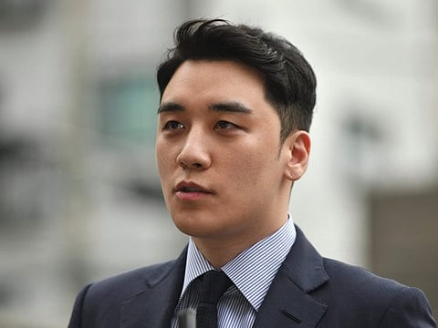 This file photo taken on August 28, 2019 shows former BIGBANG boyband member Seungri, real name Lee Seung-hyun, speaking to the media as he arrives for police questioning in Seoul.