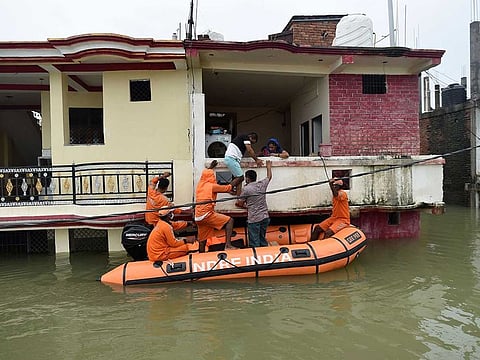 National Disaster Response Force personnel evacuate residents from inundated houses following the flooding of River Ganges, in Prayagraj, Uttar Pradesh state, India, Thursday, Aug.12, 2021. 