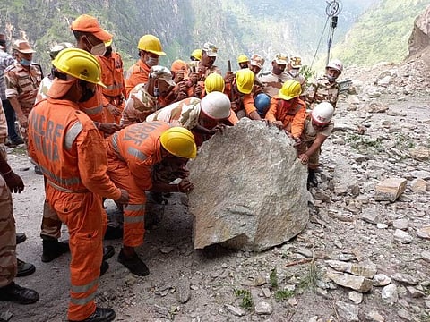 India's National Disaster Response Force soldiers during a rescue operation at the site of a landslide in Kinnaur district in the northern Indian state of Himachal Pradesh.