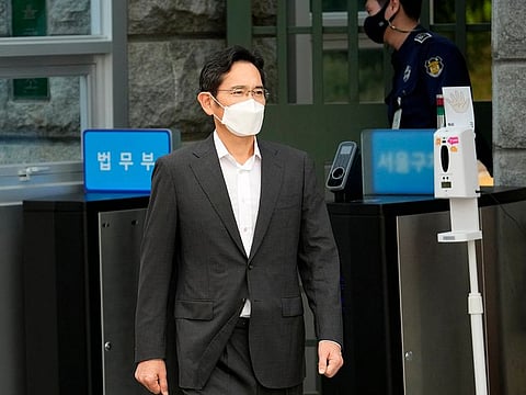 Samsung Electronics Vice Chairman Lee Jae-yong walks out from a detention center in Uiwang, South Korea, Friday, Aug. 13, 2021.