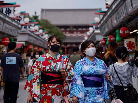 Women wearing yukatas, a traditional Japanese summer outfit, visit the Sensoji Buddhist temple on August 12, 2021 in Tokyo's Asakusa district. 