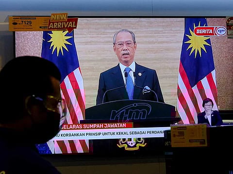 A broadcast of a news conference with Malaysia's Prime Minister Muhyiddin Yassin, is shown on televisions at a store in Kuala Lumpur Malaysia, on Monday, Aug. 16, 2021. Muhyiddin and his cabinet resigned after more than 17 months in power.
