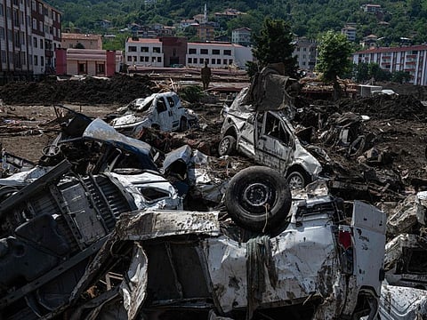 Cars destroyed in debris after the Ezine river broke its banks during flash floods in Bozkurt in the district of Kastamonu, in the Black Sea region of Turkey on August 15, 2021. 