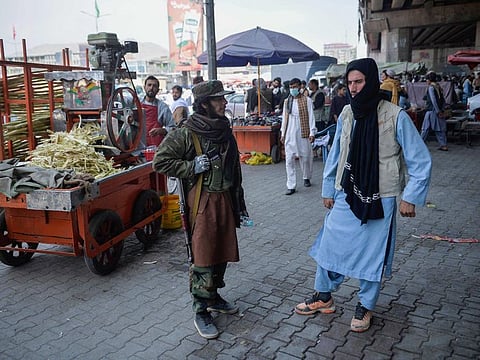 People at a crowded marketplace in Kote Sangi, Kabul, on Tuesday. 