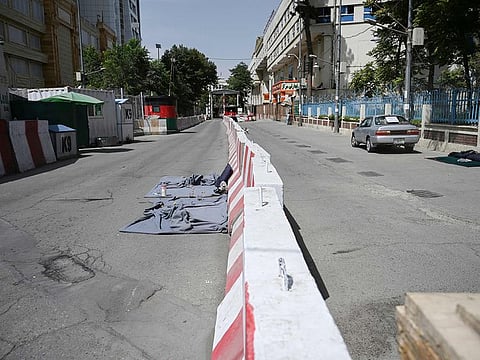 A deserted road is pictured in Kabul as the Taliban moved quickly to restart the Afghan capital following their stunning takeover, telling government staff to return to work.