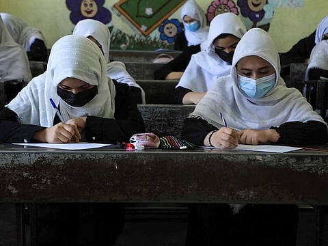 Schoolgirls attend class in Herat on August 17, 2021, following the Taliban stunning takeover of the country. 
