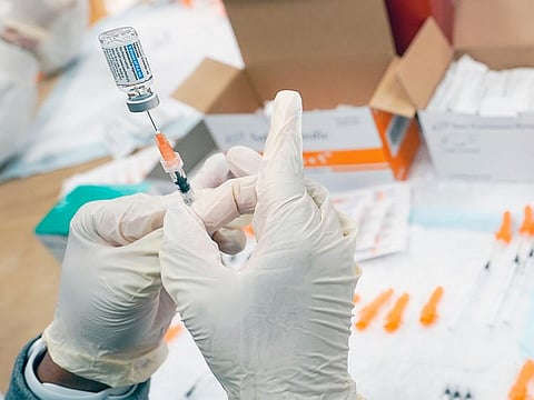 A nurse fills a syringe with the Johnson & Johnson COVID-19 vaccine at a pop up vaccination site in the Staten Island borough of New York. 