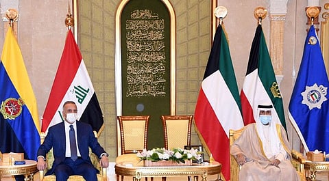A photo provided by the Kuwaiti news agency KUNA on August 22, 2021 shows Emir of Kuwait Sheikh Nawaf Al Ahmed Al Jaber Al Sabah receiving Iraq's Prime Minister Mustafa Al Kadhimi in Kuwait City. 