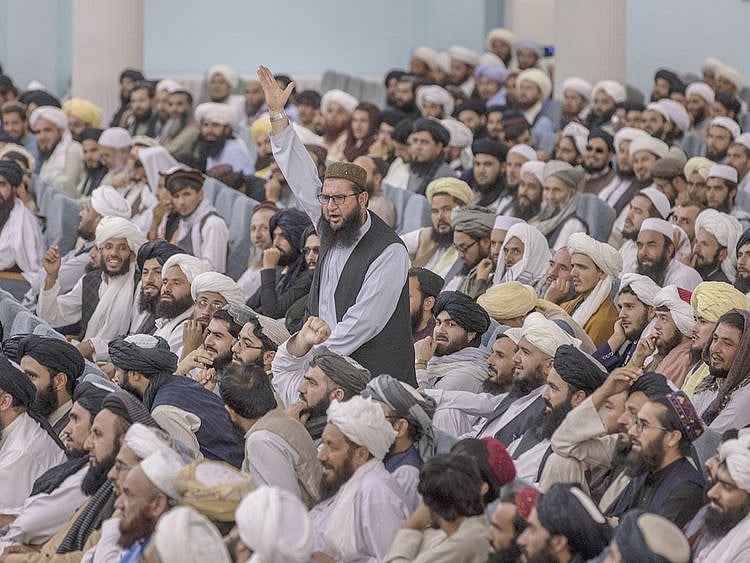 People attend the Taliban’s Preaching and Guidance Commission public event