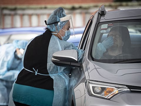 A driver has a COVID-19 test at a driver through clinic in Auckland, New Zealand, on August 19, 2021.