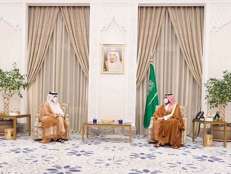 A handout picture provided by the Saudi Royal Palace shows Saudi Crown Prince Mohammed bin Salman (R) during a meeting with Qatar's Foreign Minister Sheikh Mohammed bin Abdulrahman Al Thani on August 25, 2021 in Riyadh.