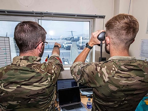 Members of the UK Armed Forces during their deployment to support the evacuation of British nationals and entitled personel at Kabul airport in Afghanistan.  