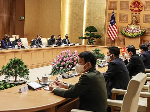US Vice President Kamala Harris meets Vietnam's Prime Minister Pham Minh Chinh during a meeting at the Office of Government, in Hanoi, Vietnam, on August, 25, 2021. - United States Vice President Kamala Harris landed in Vietnam Tuesday after an "anomalous health incident" in Hanoi delayed her flight from Singapore, the US embassy said, an apparent reference to the so-called "Havana syndrome" that has sickened diplomats in several countries.  
