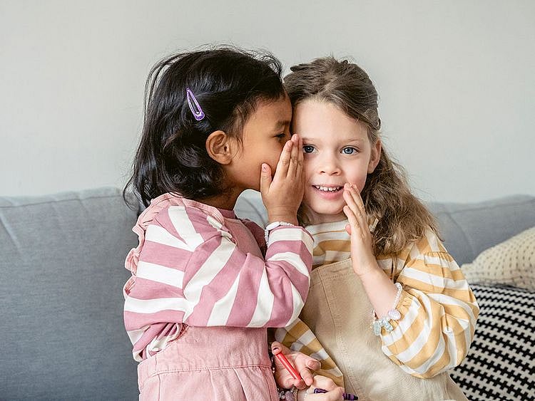 children whispering
