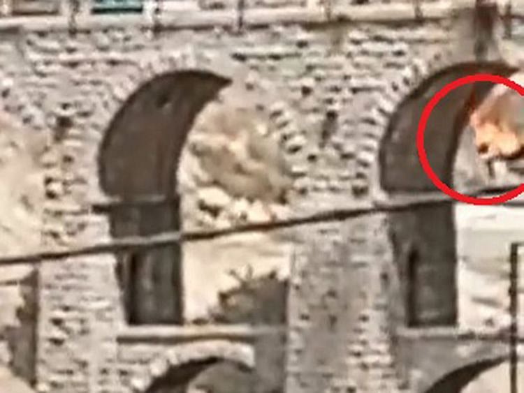 The man falling the Ten Arches Bridge in east of Amman.