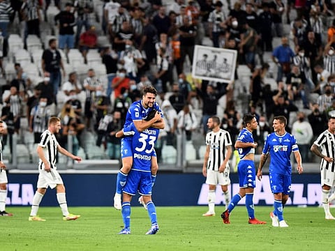 Empoli's Sebastiano Luperto celebrates after beating Juventus 1-0.