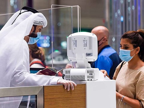  Passengers at the passport control in Dubai airport.