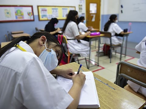 Students of Delhi Private School in Sharjah on the first day of school after summer vacation on Sunday. 