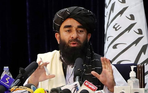 Taliban spokesman Zabihullah Mujahid speaks during a news conference in Kabul.