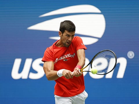 Novak Djokovic of Serbia returns the ball during a practice session prior to the start of the 2021 US Open at USTA Billie Jean King National Tennis Center in the Queens borough of New York City.