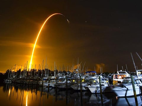 This long exposure photo shows the launch of a SpaceX Falcon 9 rocket on a resupply mission for NASA to the International Space Station from Pad 39A at Kennedy Space Center, seen from Merritt Island on August 29, 2021. 