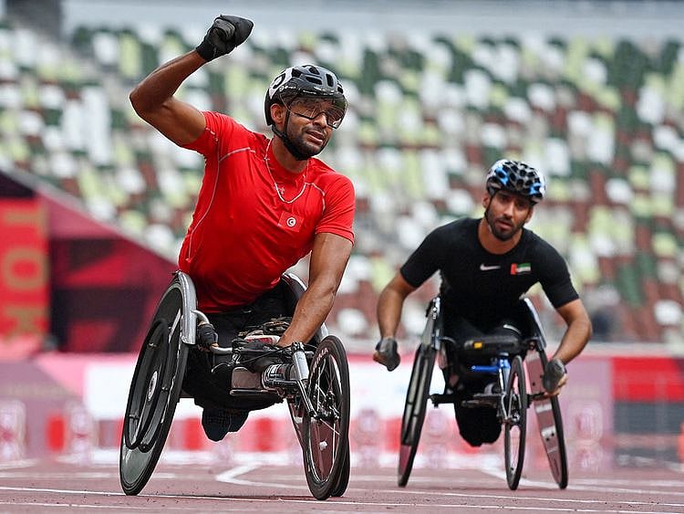 UAE's Mohammed Al Hammadi, right, with gold medal winner Walid Ktila after the men’s wheelchair 100m T34 at the Tokyo 2020 Paralympics