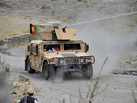 File photo: Afghan security forces patrol on a Humvee vehicle at Parakh area in Bazarak, Panjshir province on August 19, 2021, after the Taliban stunning takeover of Afghanistan.  