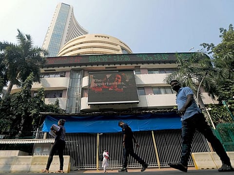 People walk past the Bombay Stock Exchange (BSE) building in Mumbai, India.