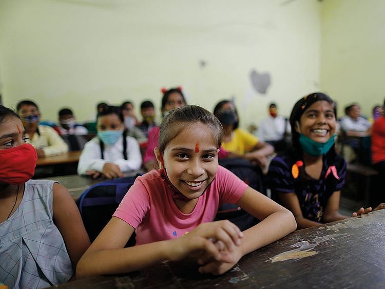  Students attend a class on the first day of partial reopening of schools in Prayagraj, on September 1, 2021.