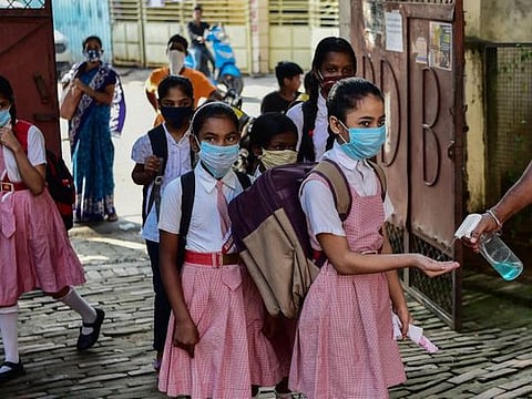 Photos: India schools reopen with strict COVID rules 