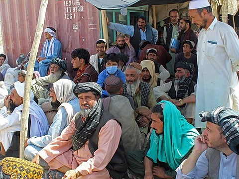 Afghanistan and Pakistani nationals gather to enter Afghanistan as they wait for the reopening of the Pakistan-Afghanistan border crossing point in Chaman on September 2, 2021. 