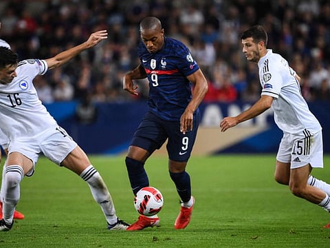 France's forward Anthony Martial (centre) fights for the ball with Bosnia-Herzegovina's defender Anel Ahmedhodzic (left) and Bosnia-Herzegovina's defende Branimir Cipetic during their FIFA World Cup Qatar 2022 qualification Group D match at the Meineau stadium in Strasbourg, eastern France.